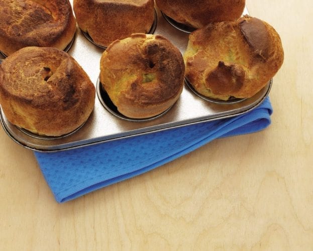 Risen Yorkshire puddings in a tray