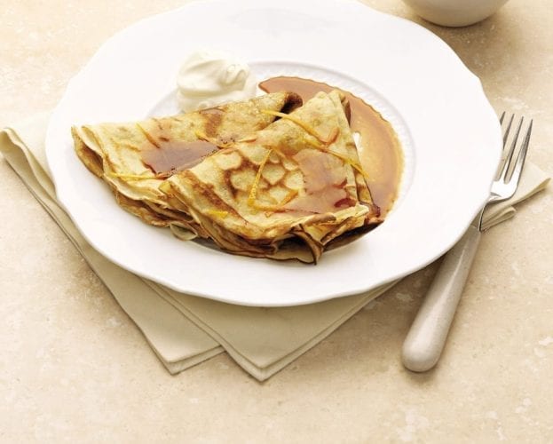 Crepe suzettes on a white plate