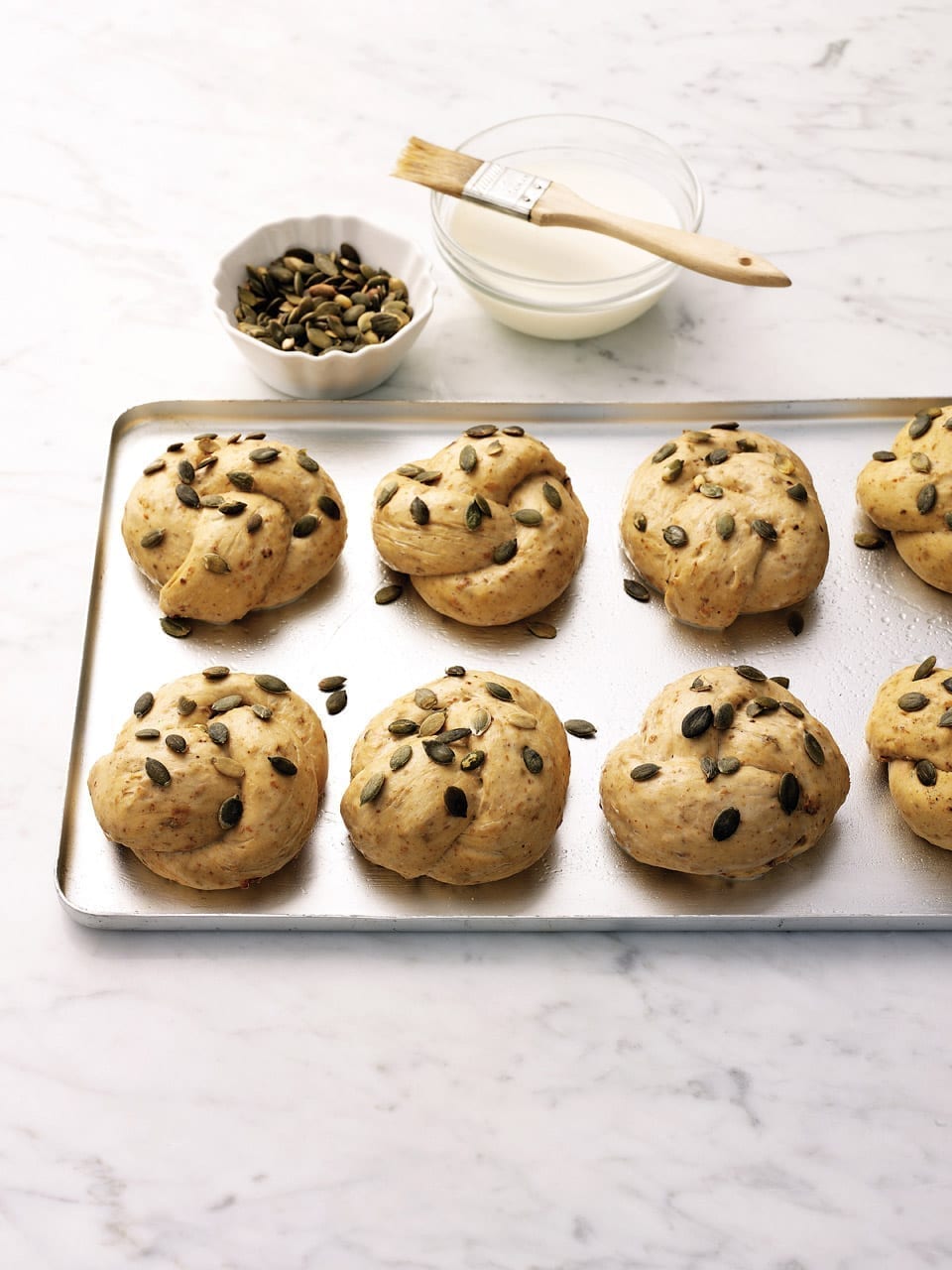 Brown knot rolls with pumpkin seeds recipe | delicious. magazine