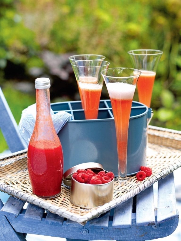 Peach and raspberry Champagne cocktail