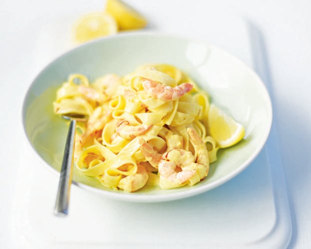 Saffron and prawn pasta shown in a bowl