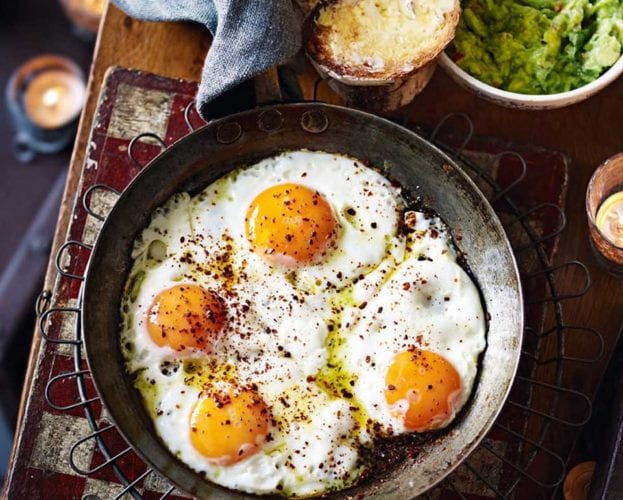 Leek and spring greens soup with soft eggs and crispy capers