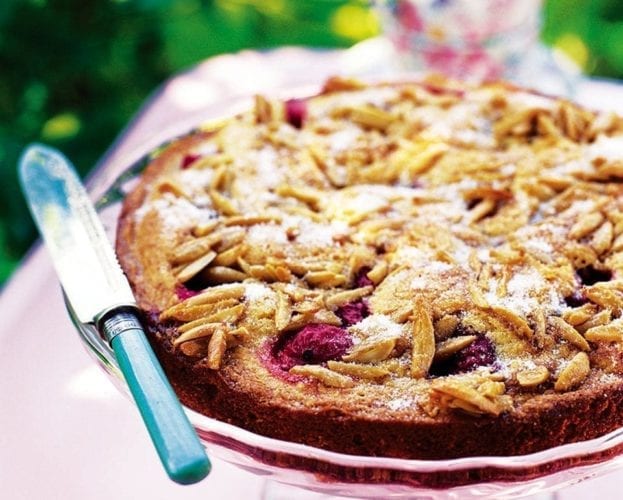 Gooseberry dimple cake on a cake stand