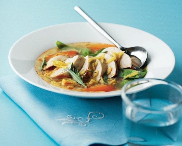 Poached chicken with summer vegetables and chive butter sauce