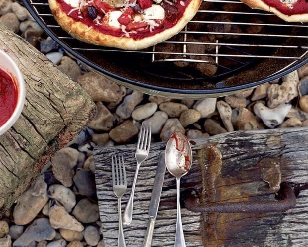 Pizza being cooked on a barbecue