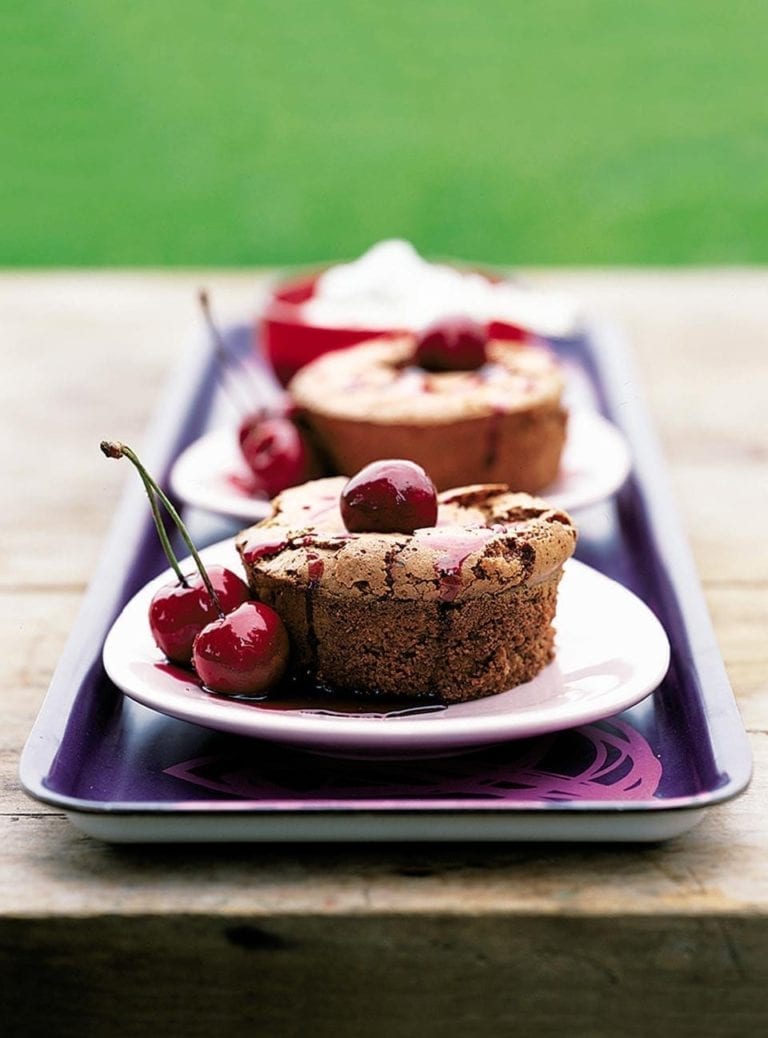 Gooey chocolate puds with whole cherry sauce