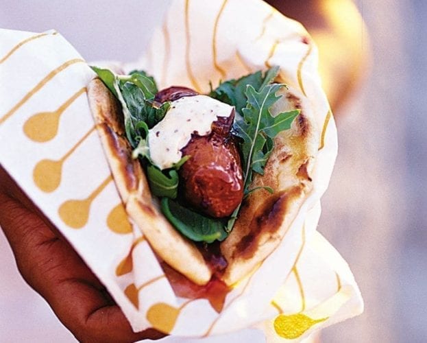 Hot sausage pittas with caramelised onions and mustard mayo