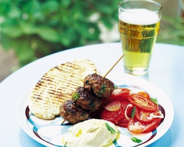Moroccan lamb burgers with tomatoes, houmous and pitta