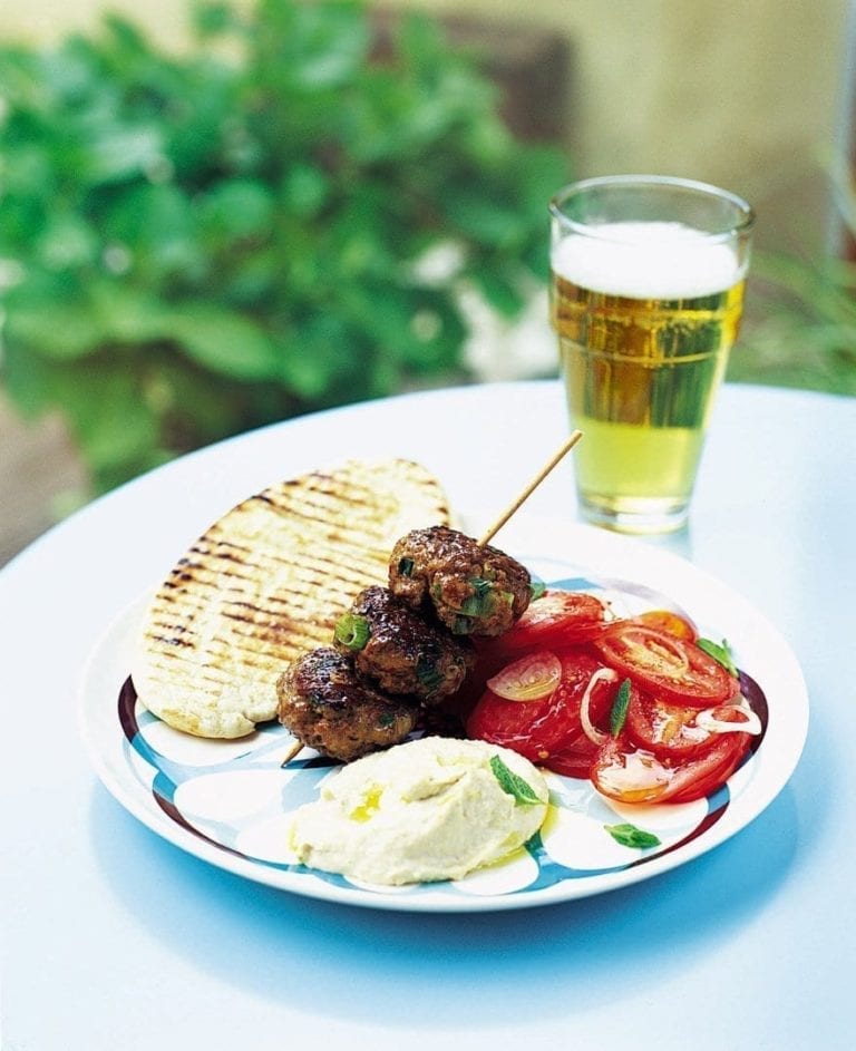 Moroccan lamb burgers with tomatoes, houmous and pitta