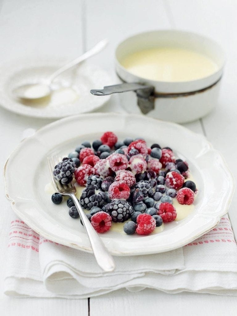 Frozen berries with hot white chocolate sauce