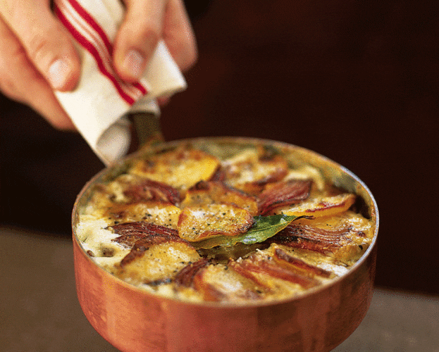 Slivered potatoes with white onion and Lancashire cheese