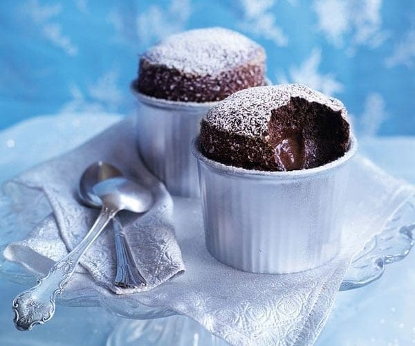 Vanilla and ginger soufflés with blackberry gin sauce