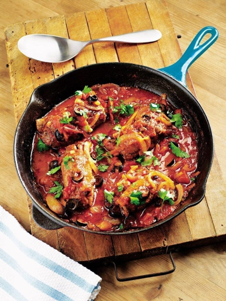 Stuffed beef rolls in a tomato and olive sauce