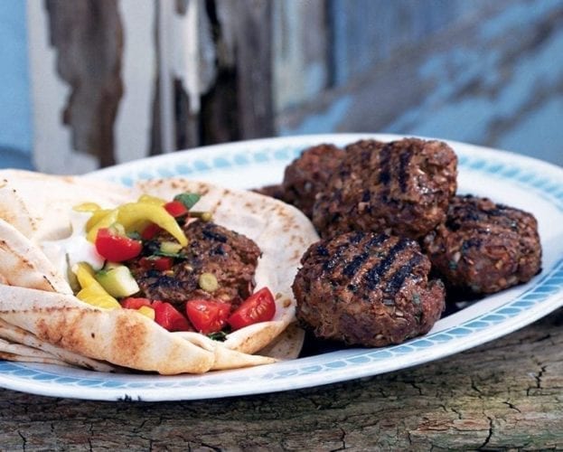 Moroccan lamb burgers with tomatoes, houmous and pitta