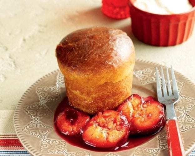 Brioche-style babas with plums shown on a plate