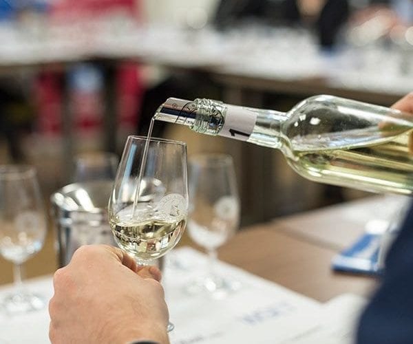 White wine being poured into a glass