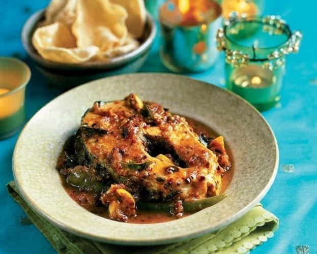 Meen kolumbu (monkfish curry) shown in a bowl