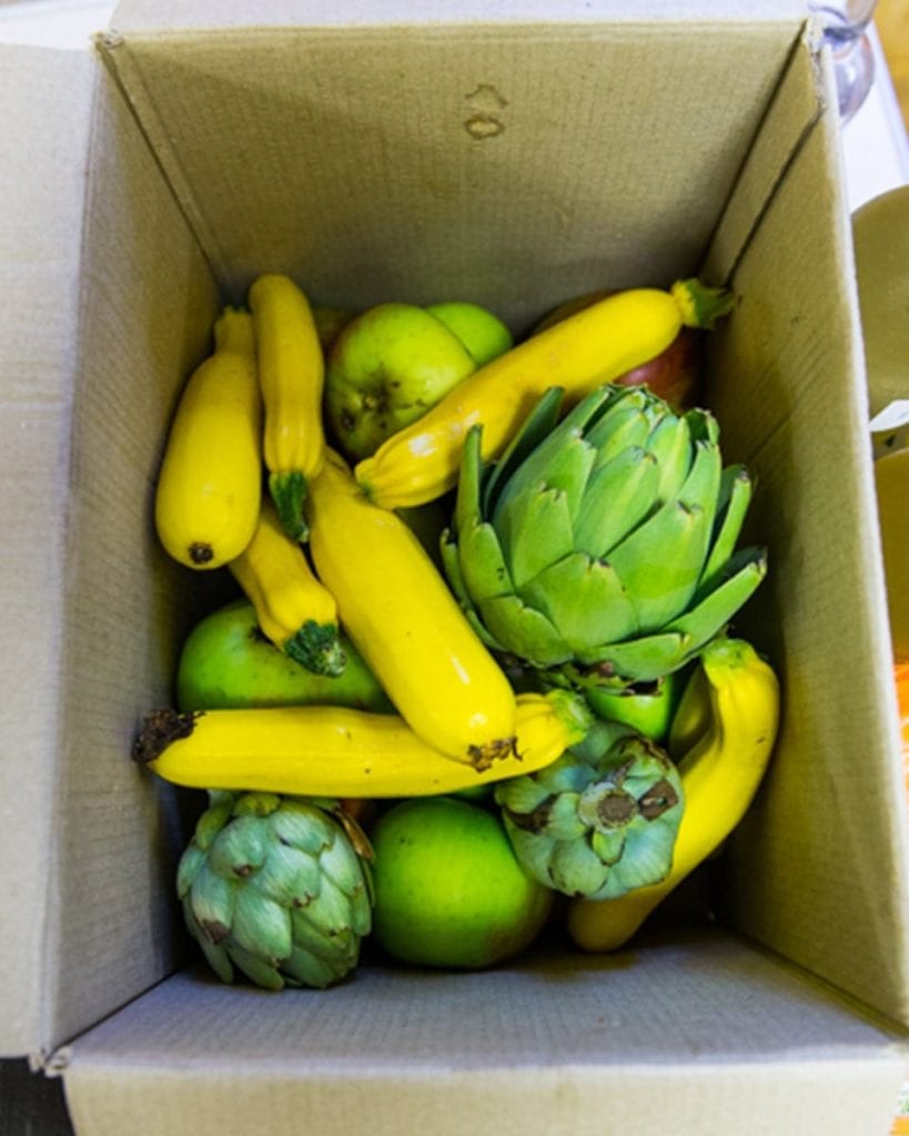 Courgettes and artichokes in a box