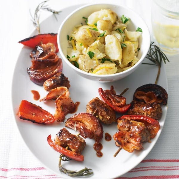 Cheat’s sticky sausage kebabs with lemon potatoes