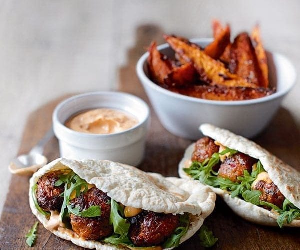 Hot sausage pittas with caramelised onions and mustard mayo