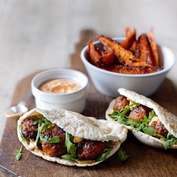 Spicy pork meatball pittas with harissa mayo and sweet potatoes