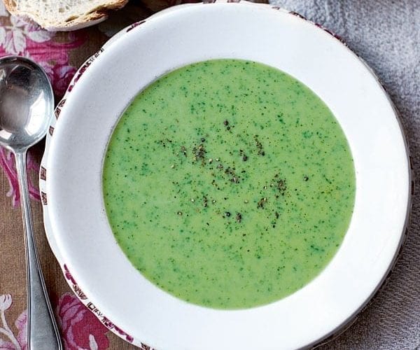 Watercress and parsley soup in a white bowl