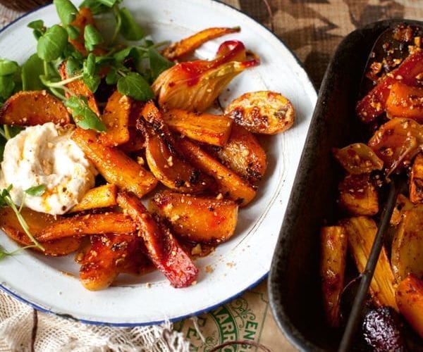 Roasted vegetables shown on a white plate