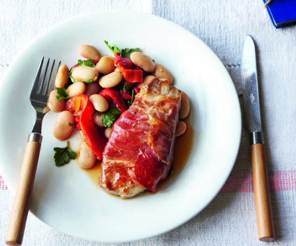 Roast pork steaks with tomatoes and pine nuts