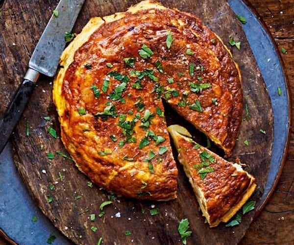Spanish tortilla sprinkled with herbs