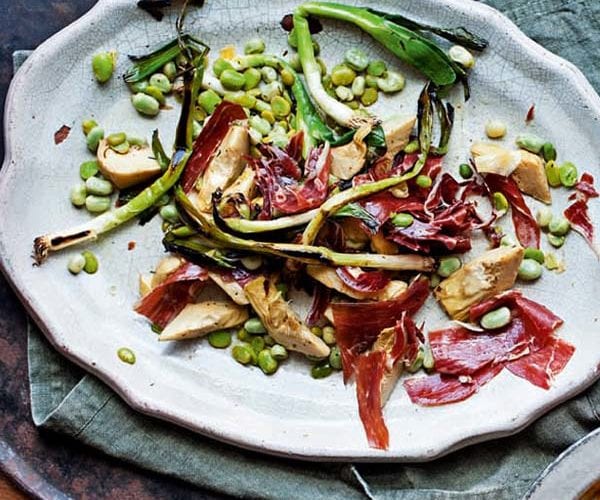 Grilled artichoke hearts with jamón, broad beans and spring onions