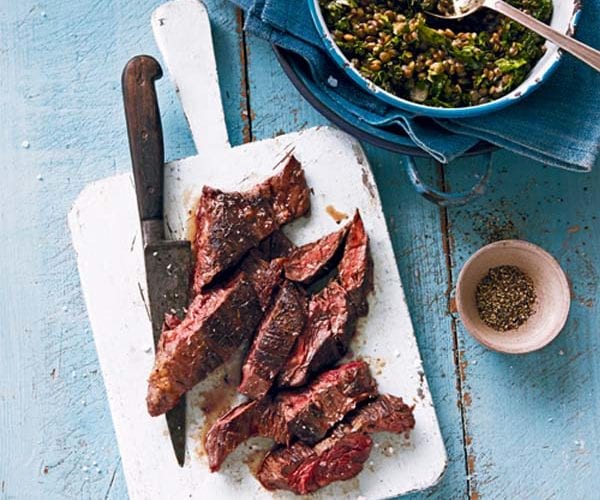 Onglet beef steak shown sliced on a chopping board
