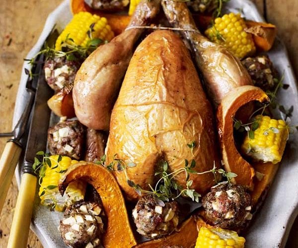 Roast chicken with vermouth, beans and grapes
