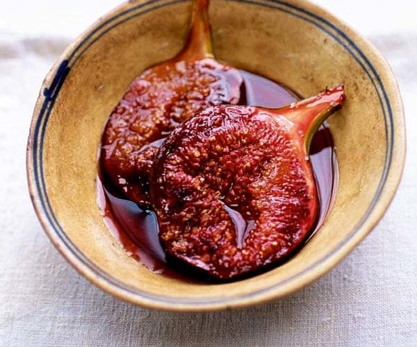 Nigel Slater's figs in red wine and jelly - figs sliced in half are shown in a bowl