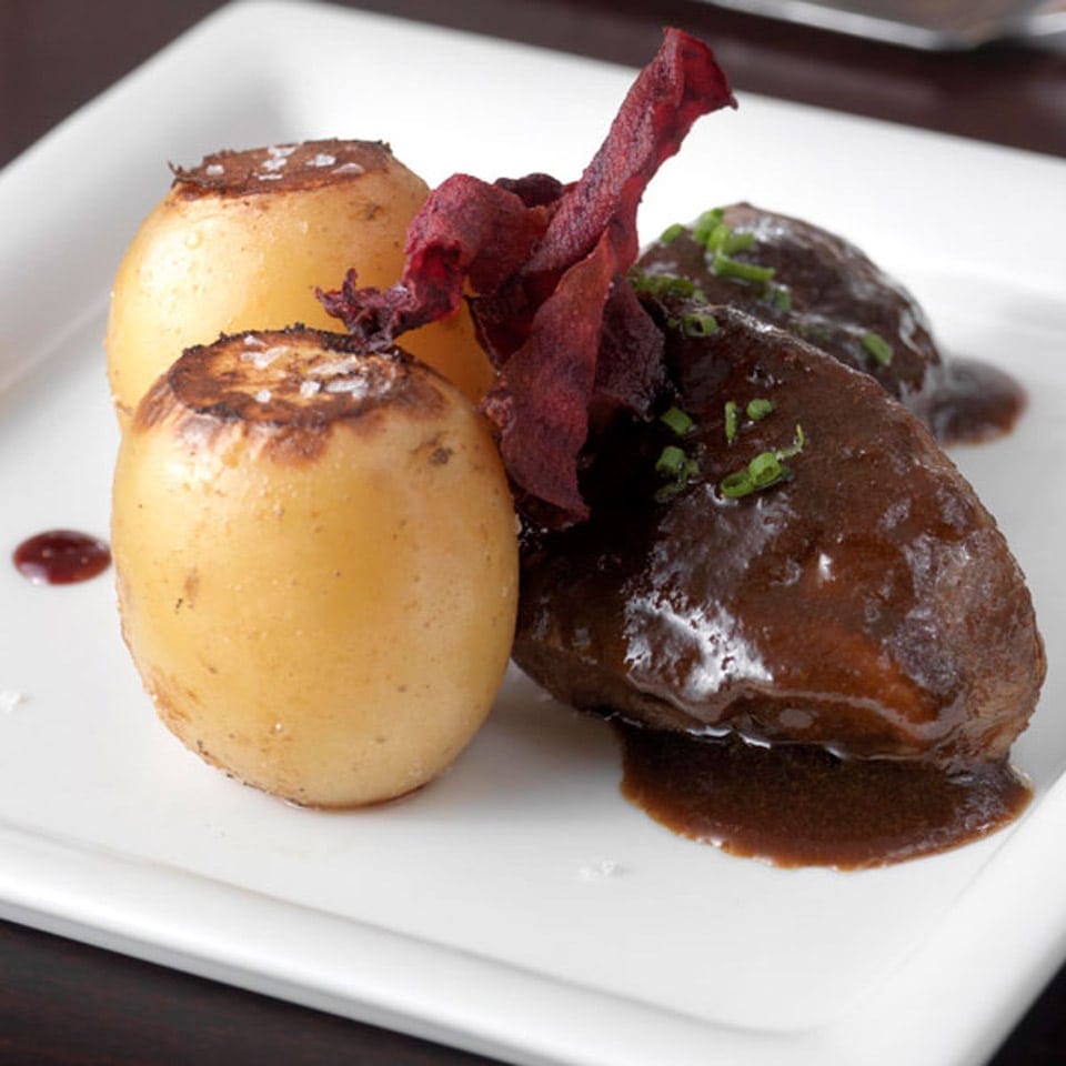 Braised pork cheeks with confit potatoes recipe | delicious. magazine