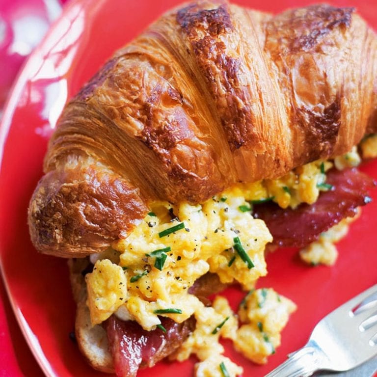 Croissants stuffed with bacon and creamy scrambled egg