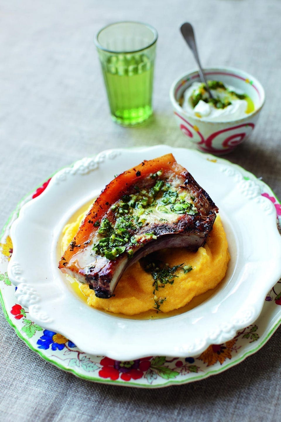 Gremolata pork chops on creamy polenta with lemon ricotta sauce recipe | delicious. magazine