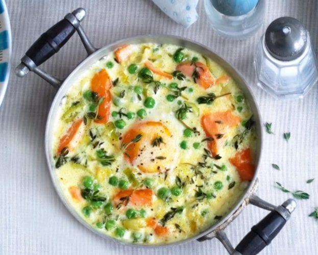 Eggs and salmon served 'en cocotte' in a silver ramekin