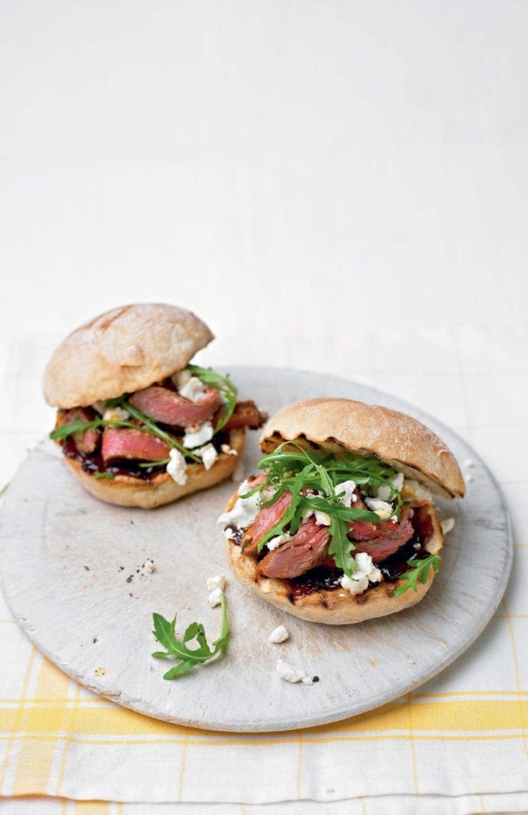 Steak sandwich with harissa, caramelised onions and feta