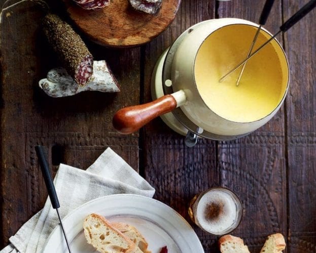 Sharing pan fondue with garlic toasts, roasted radishes and asparagus