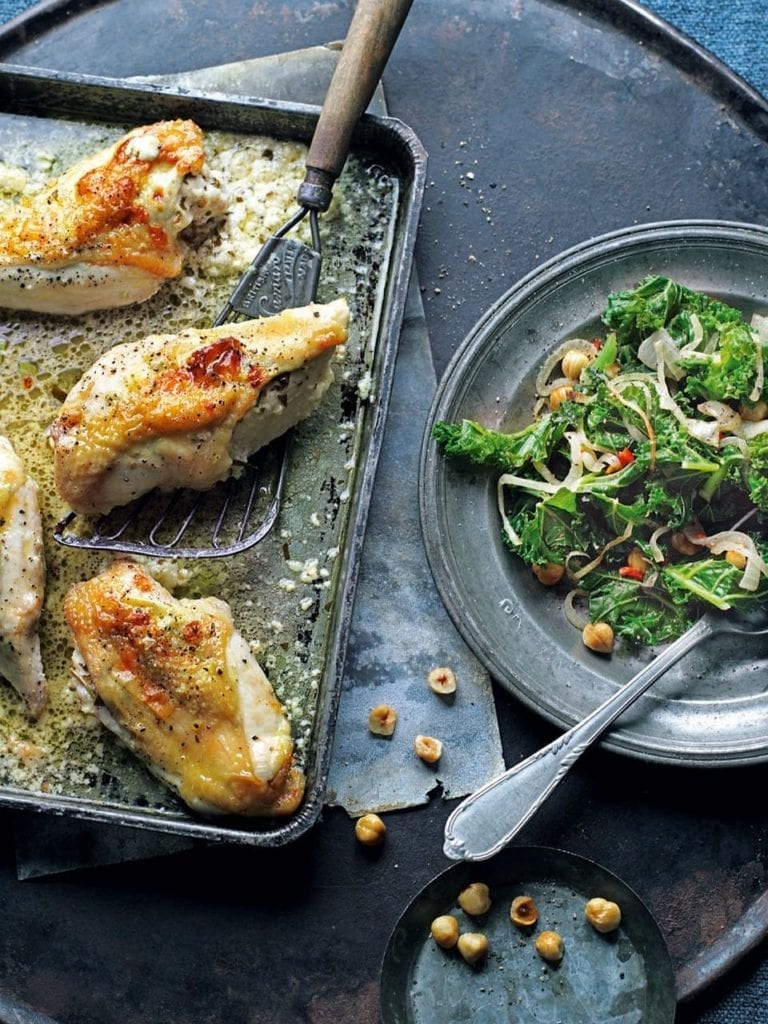 Stuffed chicken breasts with stir-fried kale and hazelnuts