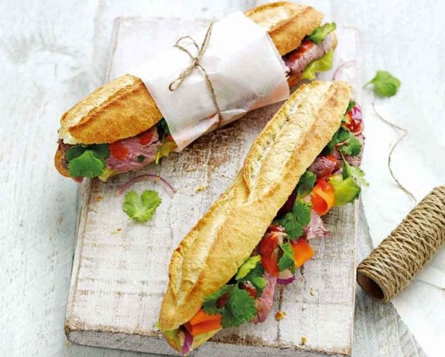 Hot sausage pittas with caramelised onions and mustard mayo