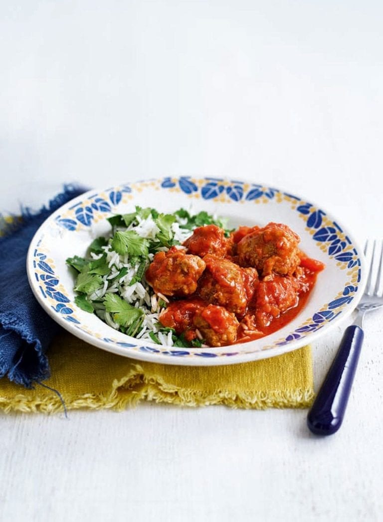 Spicy sausage meatballs in tomato sauce with herb rice