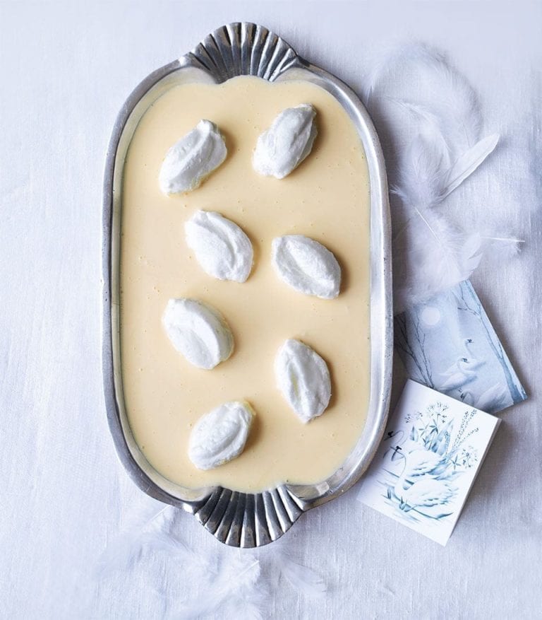 Meringue swans with orange custard