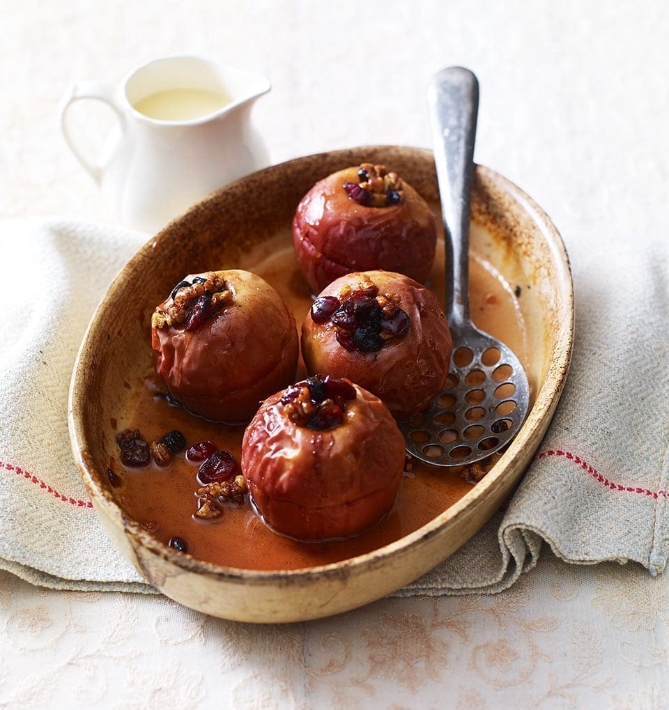 Cinnamon and berry-stuffed baked apples with maple syrup recipe | delicious. magazine