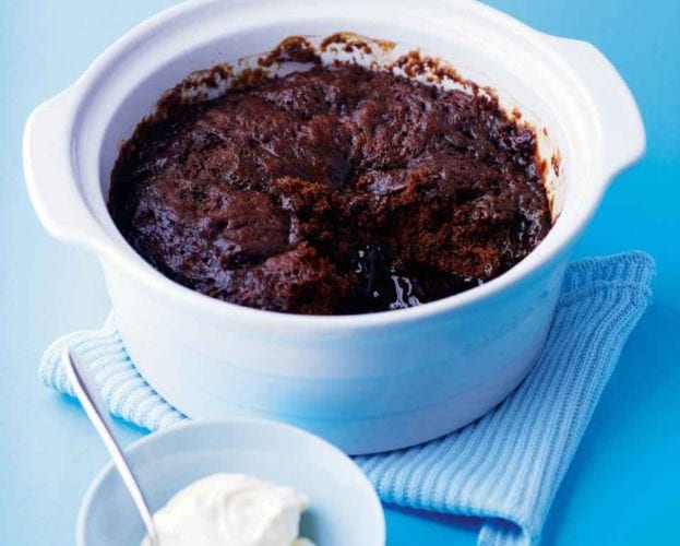 Self-saucing chocolate pudding shown cooked in a white pot