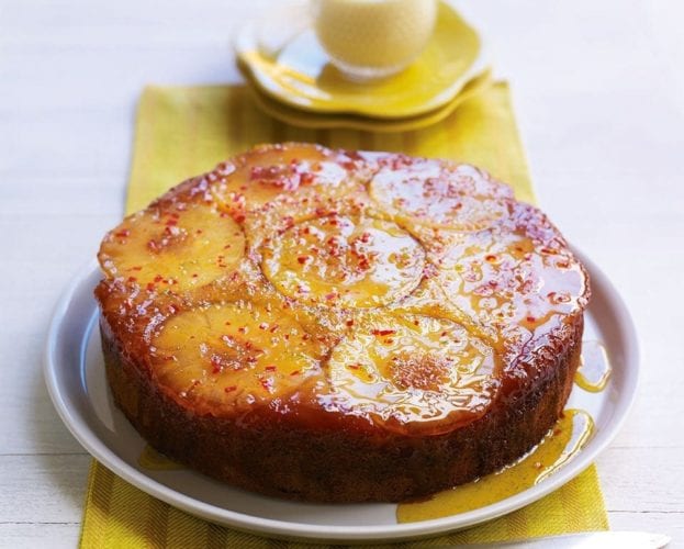 Pineapple upside down cake on a yellow napkin