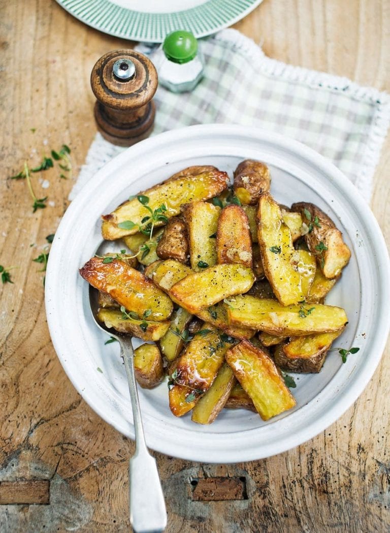 Roasted pink fir apple potatoes with slow-cooked garlic