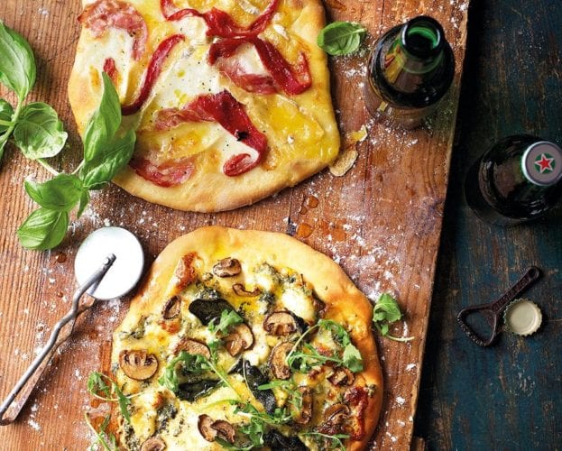Homemade pizzas on a wooden board