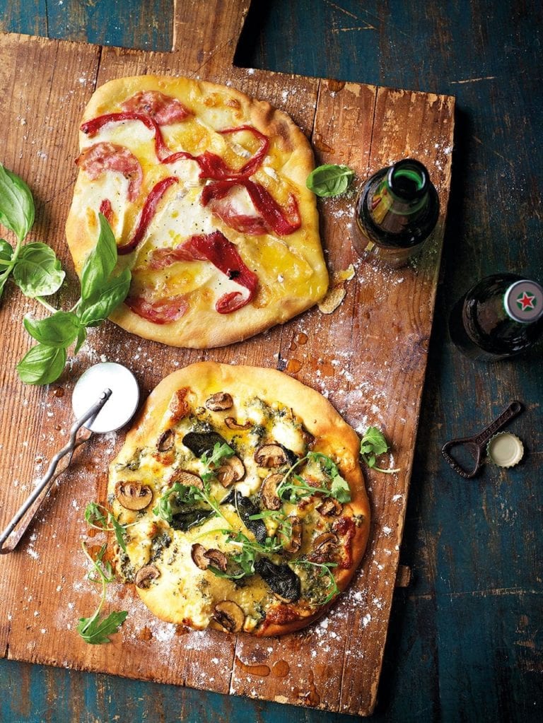 Homemade pizzas on a wooden board