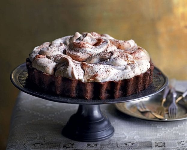 Chocolate meringue pie on a stand